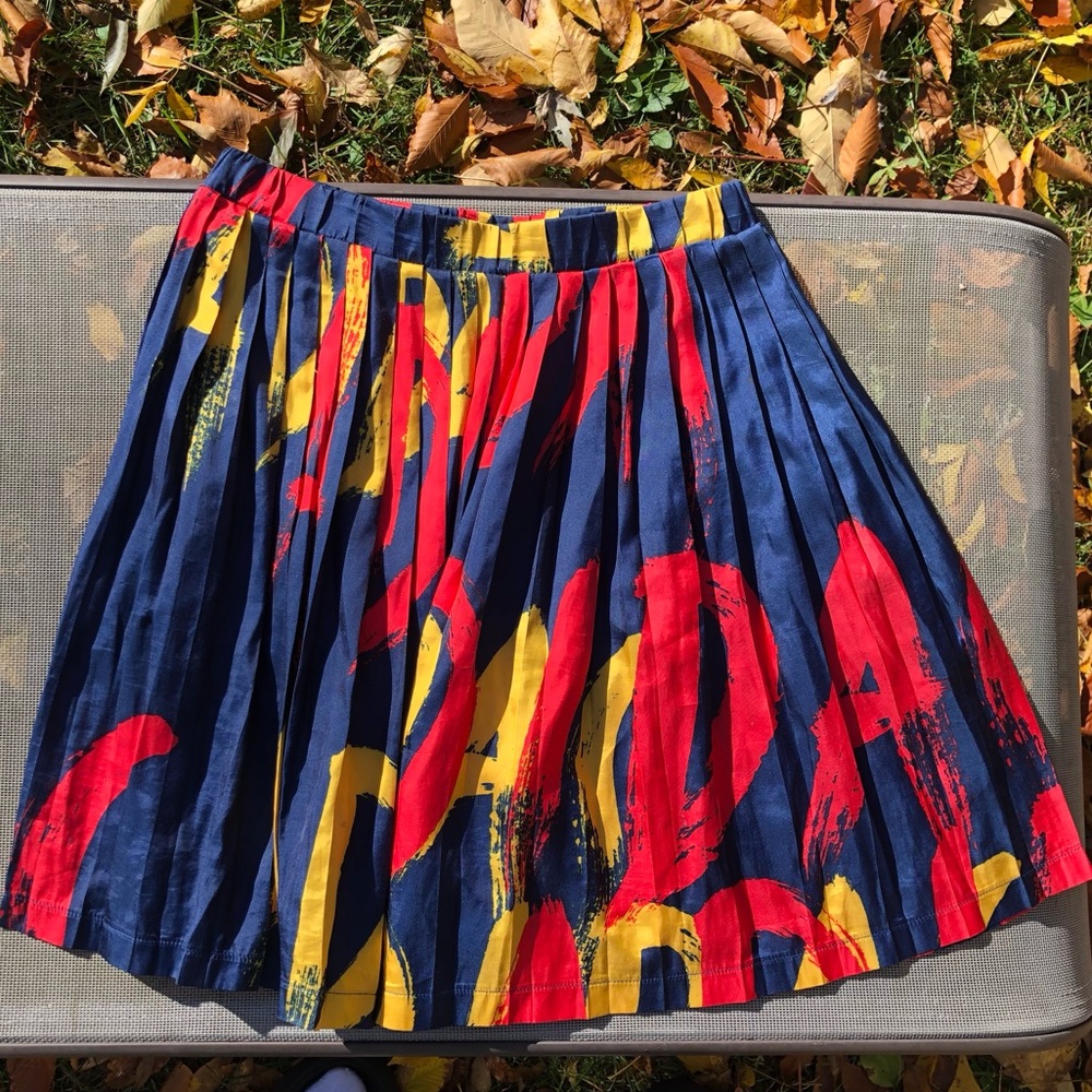 Adidas pleated skirt in blue, yellow, and red. Size XS.